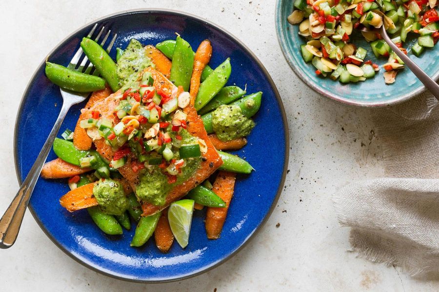 Salmon with snap peas, carrots, and red pepper–almond salsa
