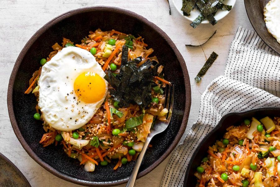 Spicy kimchi fried rice with peas, nori, and eggs