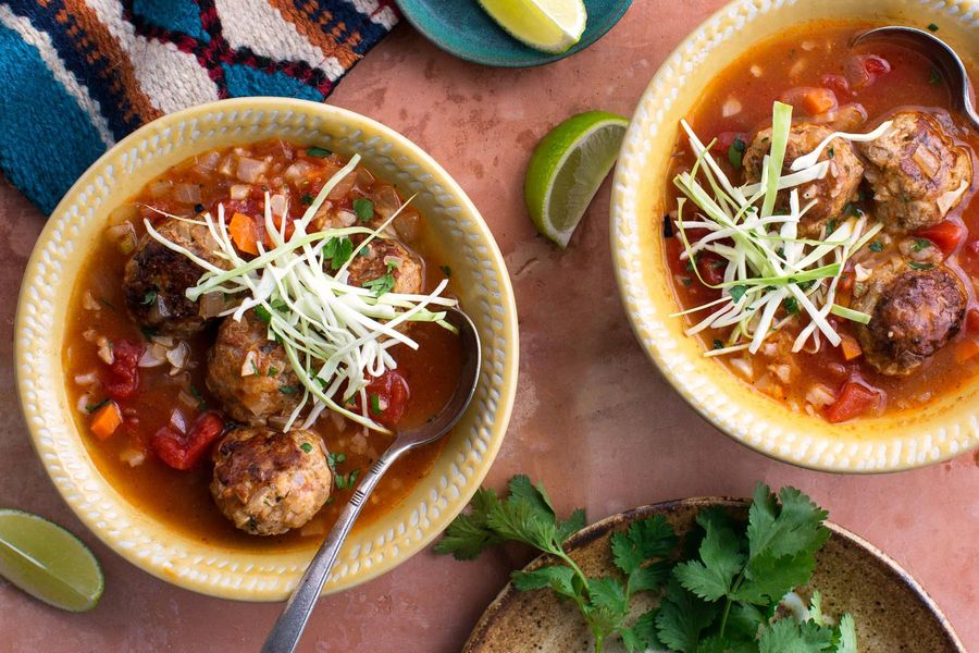 Turkey albóndigas soup with cauliflower “rice” and mole poblano