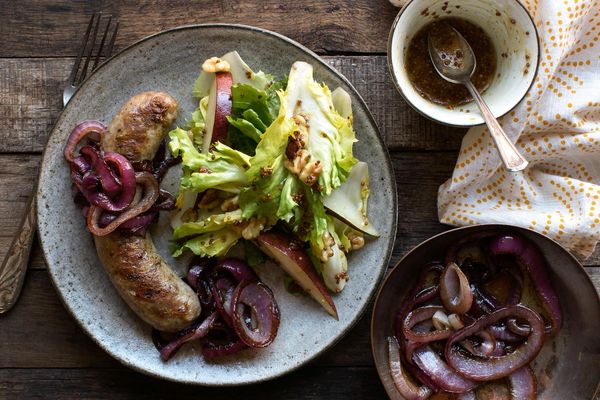 Italian sausages with pear-escarole salad and honey mustard