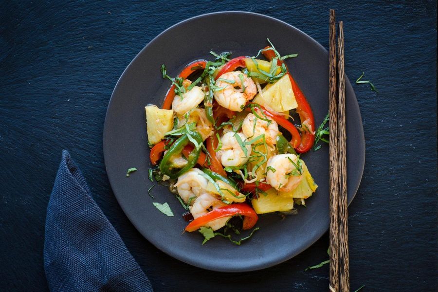 Spicy stir-fried shrimp with pineapple, bell pepper and Thai basil