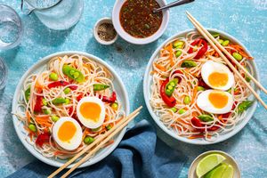 Asian rice noodle bowls with sesame dressing and soft-cooked eggs