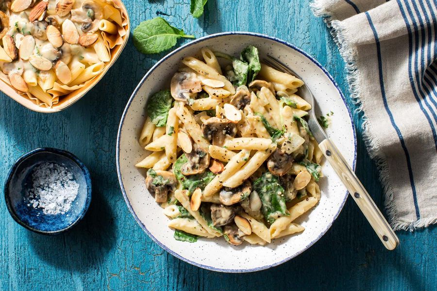 Creamy mushroom penne with baby kale and almonds