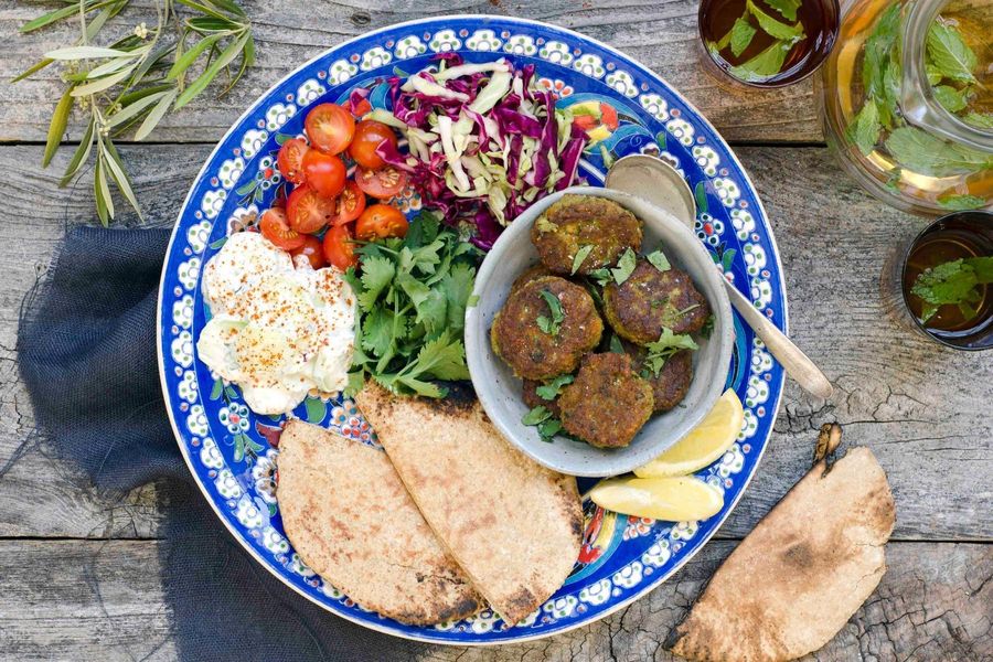 Herb-filled falafel with tzatziki, pickled cabbage and cherry tomatoes