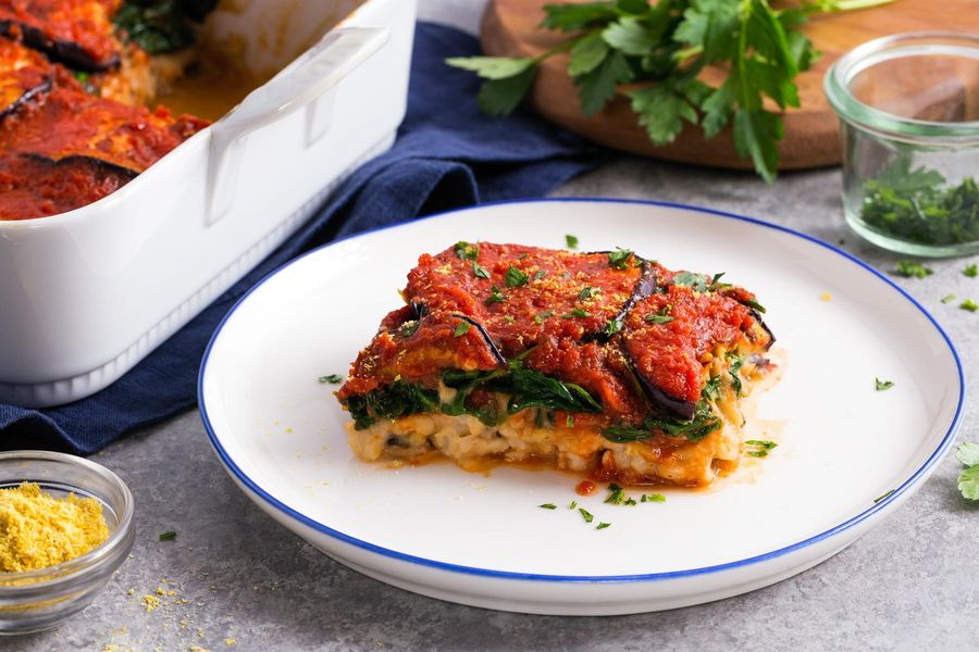 Eggplant “lasagna” with white beans and baby greens