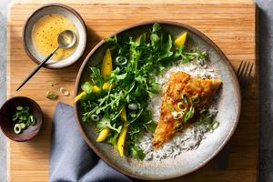Miso-glazed cod over rice with mango and arugula salad