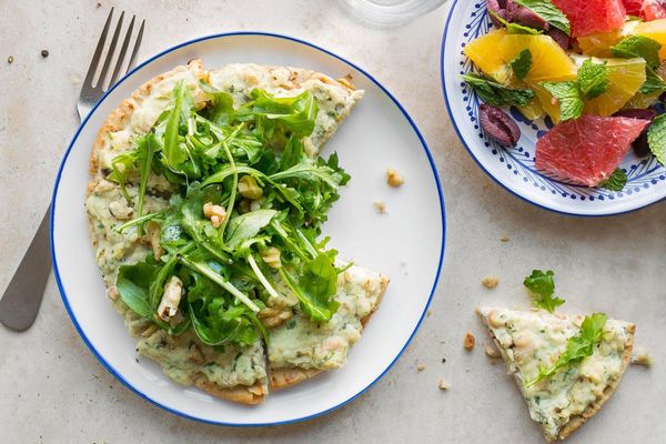 White bean and ricotta pizzettas with arugula and citrus-olive salad