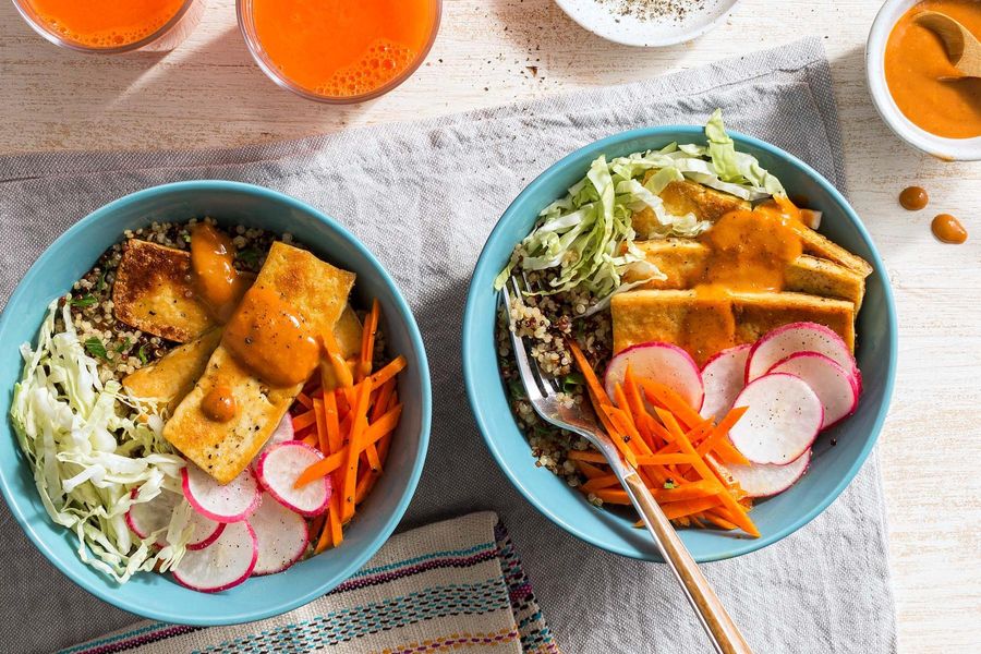 Quinoa and tofu bowls with pickled vegetables and cashew-lime dressing