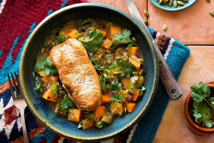 Pork chops with Southwestern sweet potatoes and tomatillos