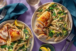 Chicken cordon bleu with prosciutto over creamy penne and spinach