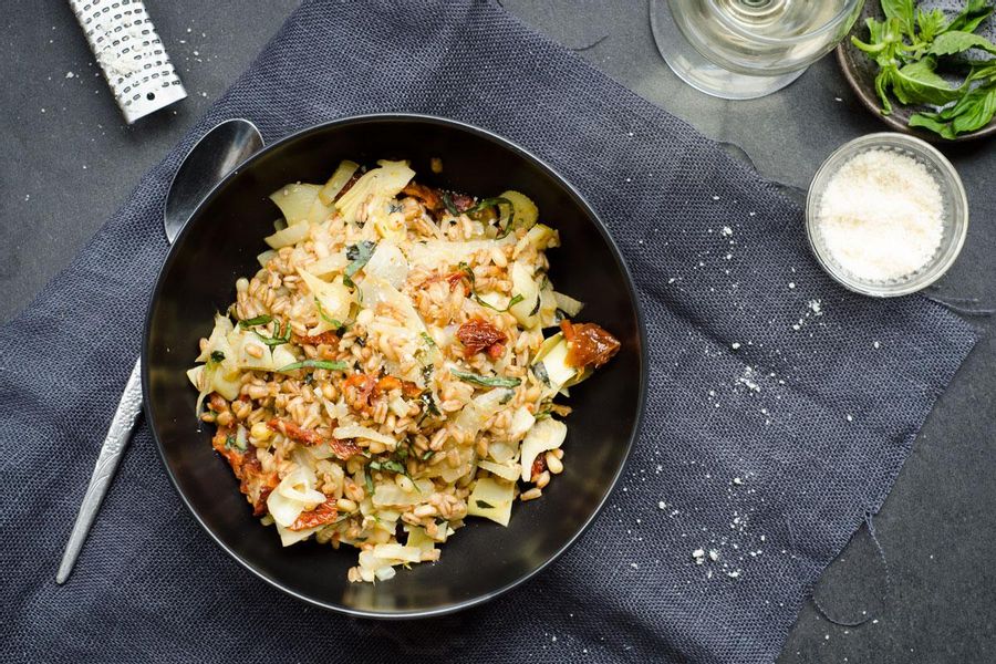 Braised fennel and artichoke farro with sun dried tomatoes and pine nuts