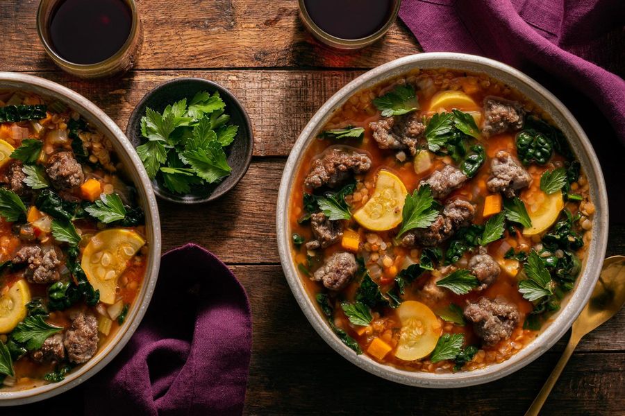 Mediterranean lentil stew with your choice of protein and wilted kale