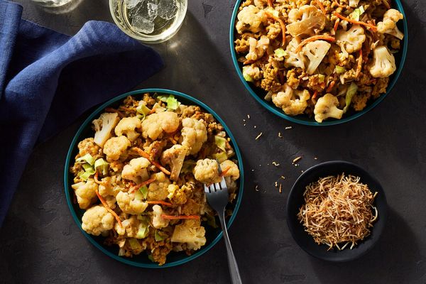 Cashew-lime curry with ground pork, cauliflower, and toasted coconut