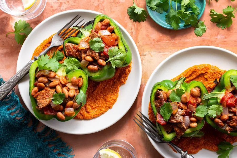 Weeknight stuffed peppers with steak, pinto beans, and romesco