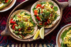 Curried chicken and grape salad with smashed cucumber and toasted pita