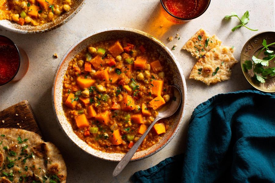 Spicy Tunisian chickpea and lentil stew with garlic flatbread