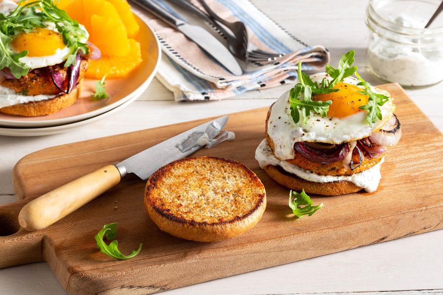 Salmon burgers with fried eggs and dill yogurt