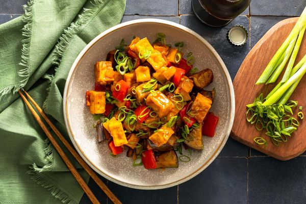 Five-spice pork and eggplant stir-fry with cashew-plum sauce