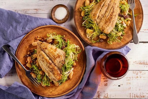 Sole over frisee and white bean salad with bagna càuda dressing