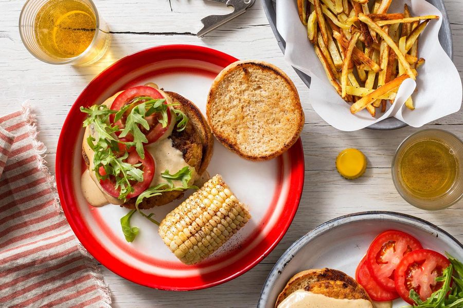 Cheesy Tofu Burgers with Corn On The Cob and Roasted Matchstick Fries Image