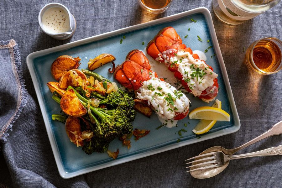 Lobster tails with creamy garlic butter sauce and roasted baby broccoli
