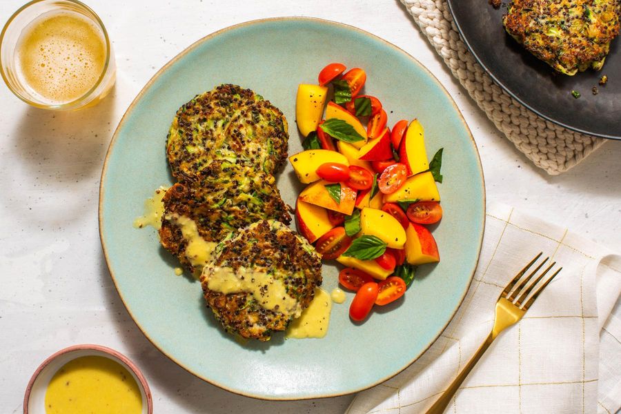 Quinoa-zucchini fritters with tahini dressing and nectarine salad