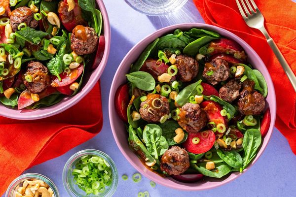 Lemongrass chicken meatballs with spinach-plum salad and cashews