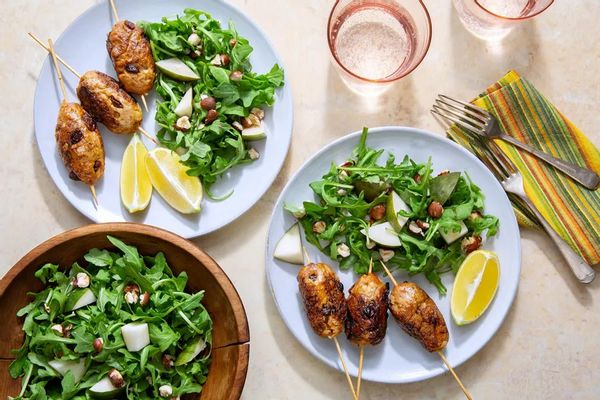 Greek beef skewers with arugula-pear salad and hazelnuts