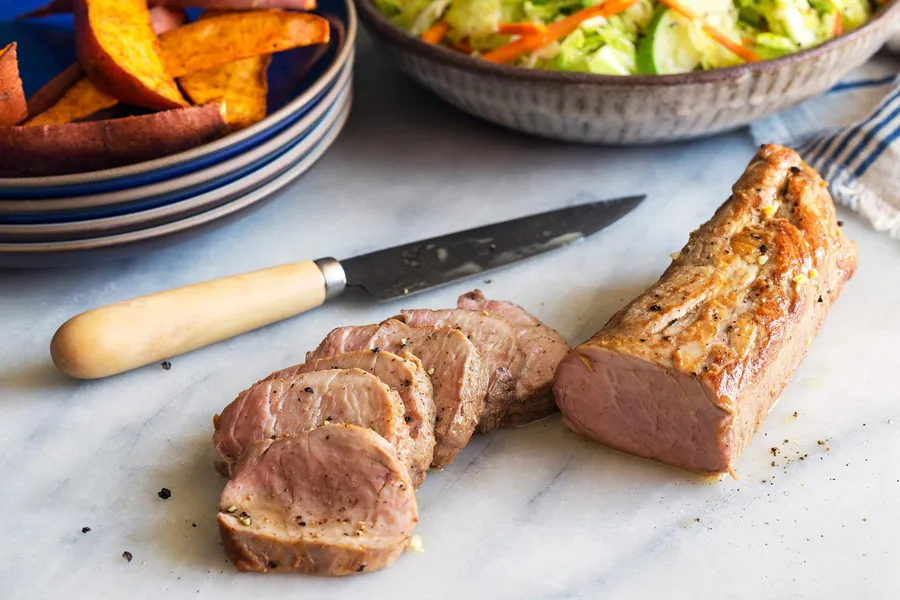 Orange chipotle–glazed pork tenderloin with apple slaw and sweet potato fries