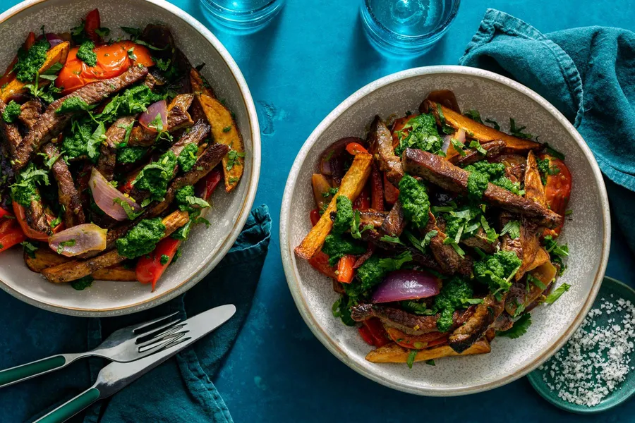 Peruvian lomo saltado with beef, tomatoes, and spicy chimichurri