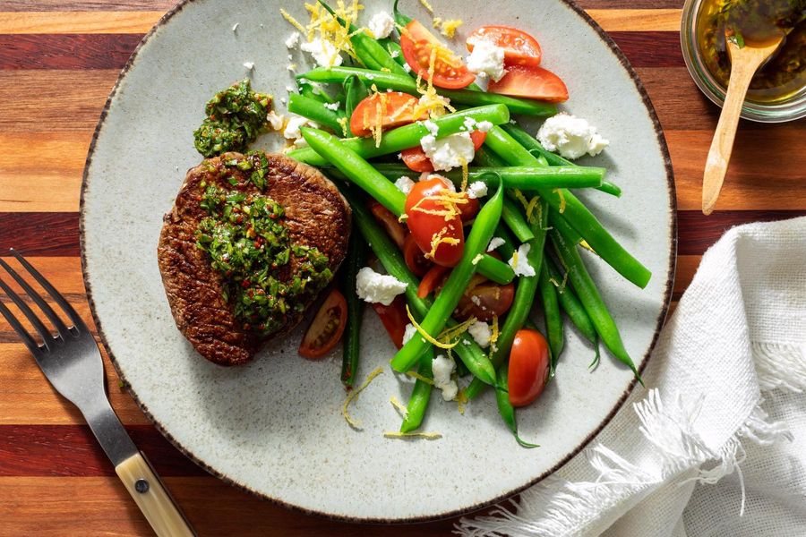 Black Angus steaks with arugula salsa verde and green bean–feta salad