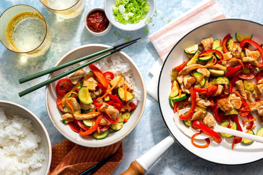 Hanoi stir-fry with zucchini and bell pepper over steamed rice