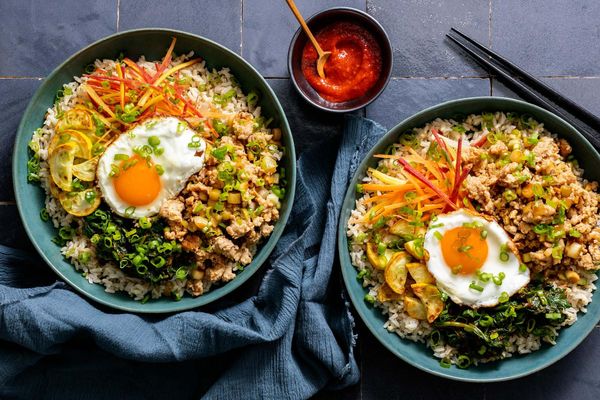 Korean beef bibimbap with spinach, squash, and fried eggs