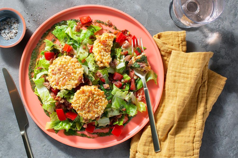 Prosciutto-couscous fritters over romaine with coconut-basil dressing