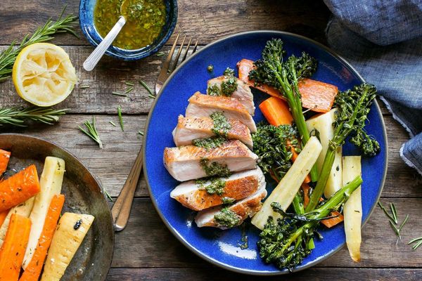 Seared pork loins with rosemary-roasted winter vegetables and chermoula