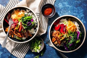 Pork bulgogi rice bowls with greens and kimchi