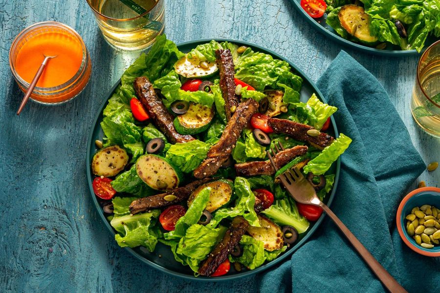 Steak and zucchini salad with olives and red pepper vinaigrette