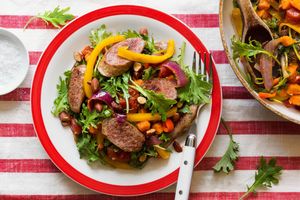 Italian sausages with sweet peppers and baby kale