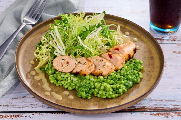 Chicken sausages over sweet pea couscous and arugula salad
