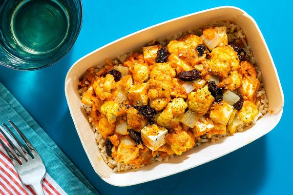 Chili-spiced tofu biryani with cauliflower, brown rice, and raisins