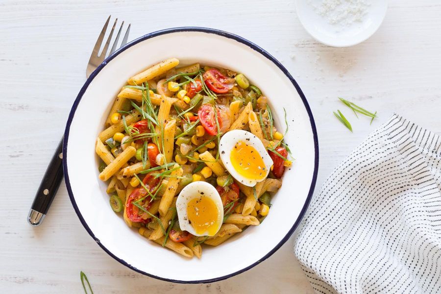 Quinoa pasta with corn, bell peppers, and tomatoes