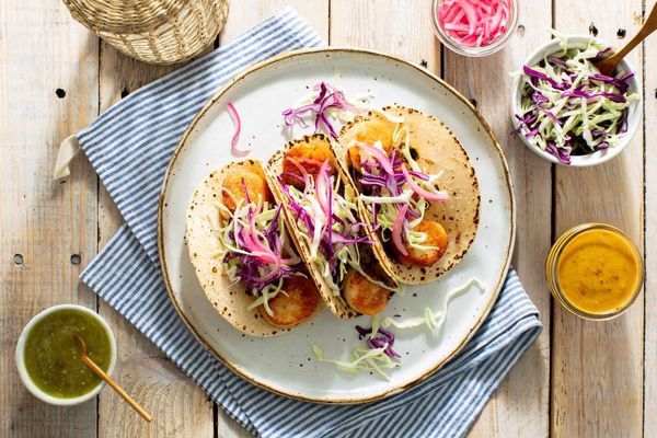 Mojo pork tacos with pickled onions and salsa verde