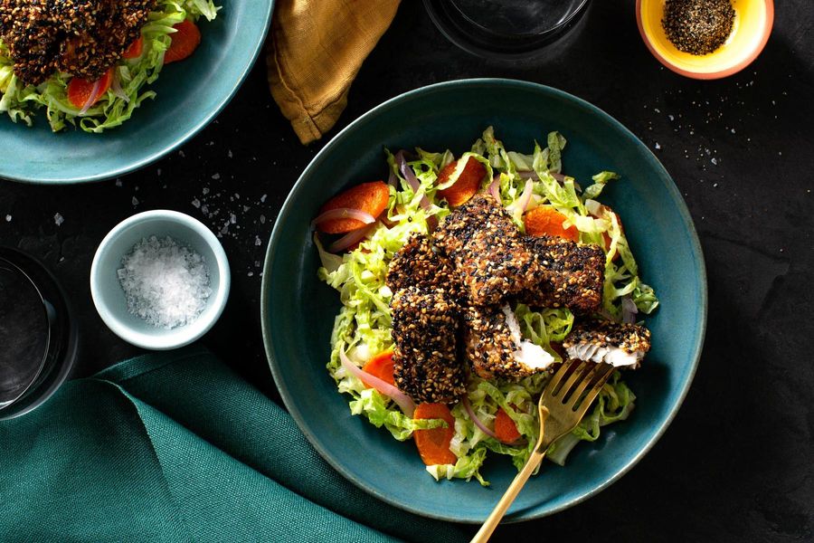 Crispy sesame-crusted fish nuggets with orange-glazed vegetables