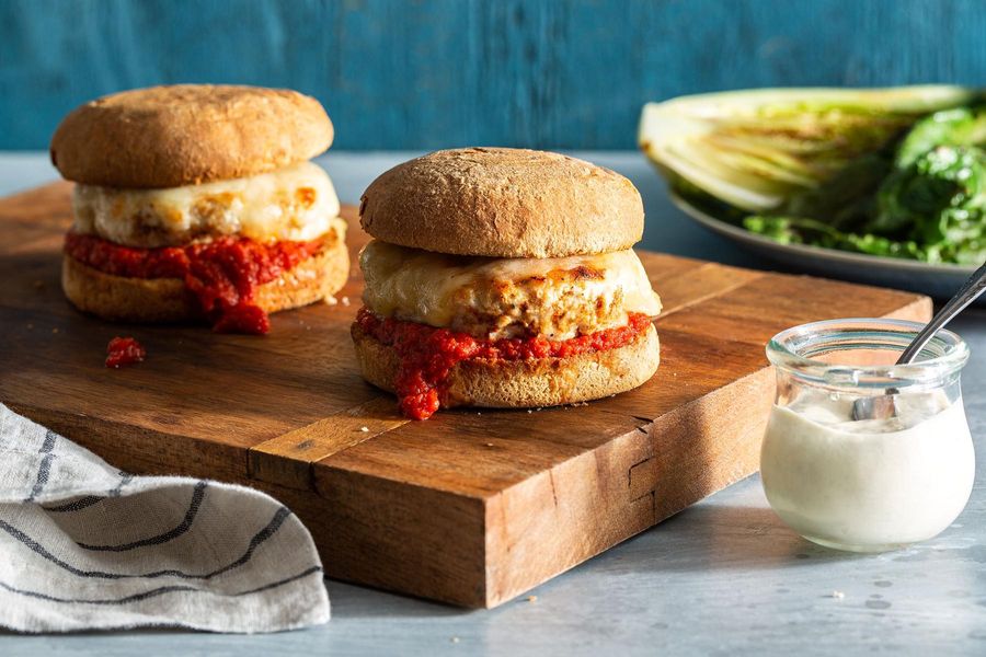 “Chicken-Parm” burgers with seared Caesar salad