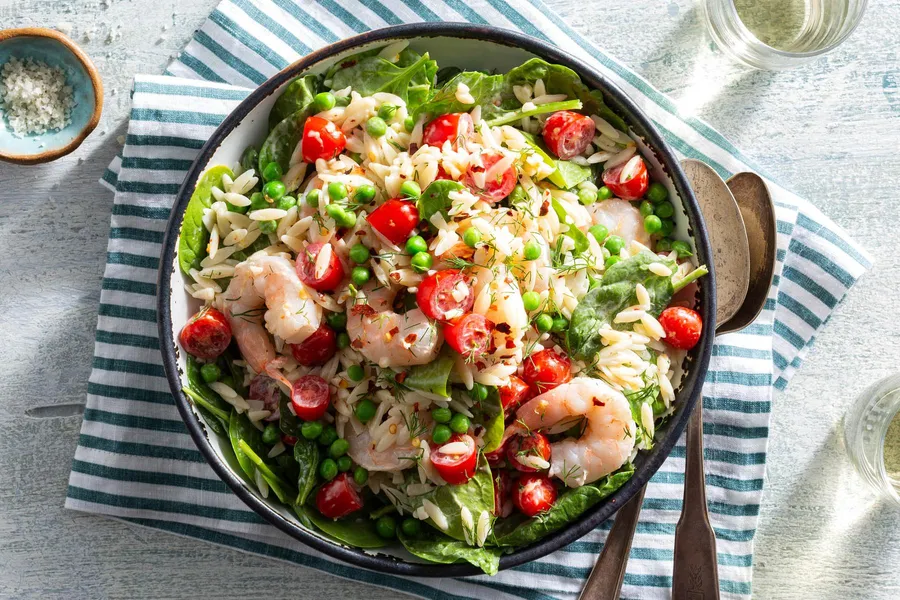 Lemony shrimp and orzo pasta salad with peas and baby greens