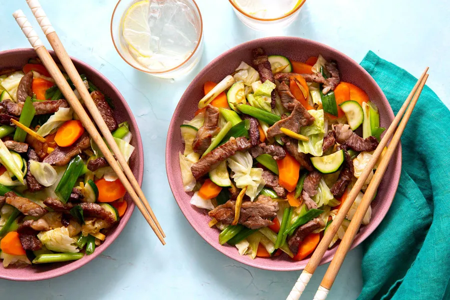 Ginger steak stir-fry with steamed cabbage, zucchini, and carrot