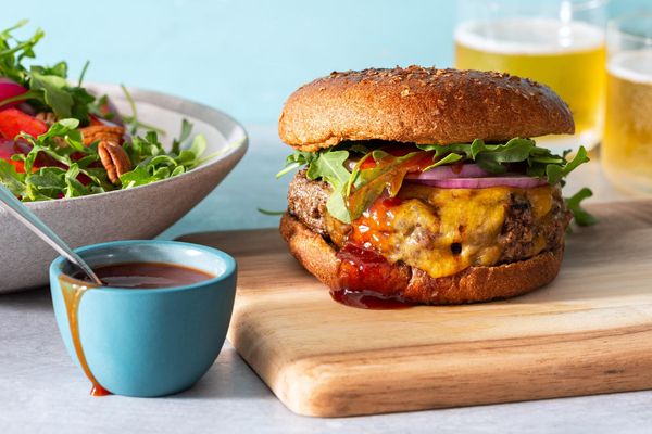 Memphis BBQ cheeseburgers with plum, pecan, and arugula salad