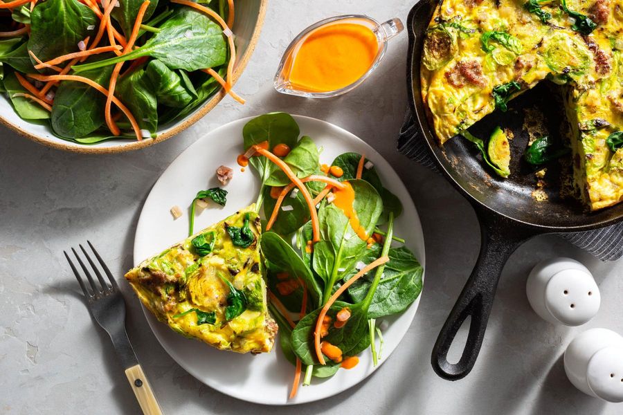 Sausage–Brussels sprouts frittata with salad and red pepper vinaigrette