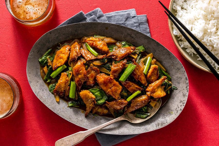 Mongolian stir-fry with spinach and scallions over steamed rice