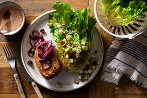 Pork with cherry compote, charred escarole, and pecan-apple relish